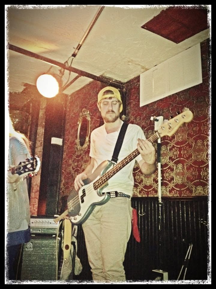 Kyle Moon performing on bass
