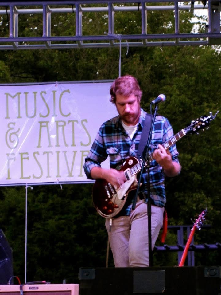Kyle Moon performing on guitar